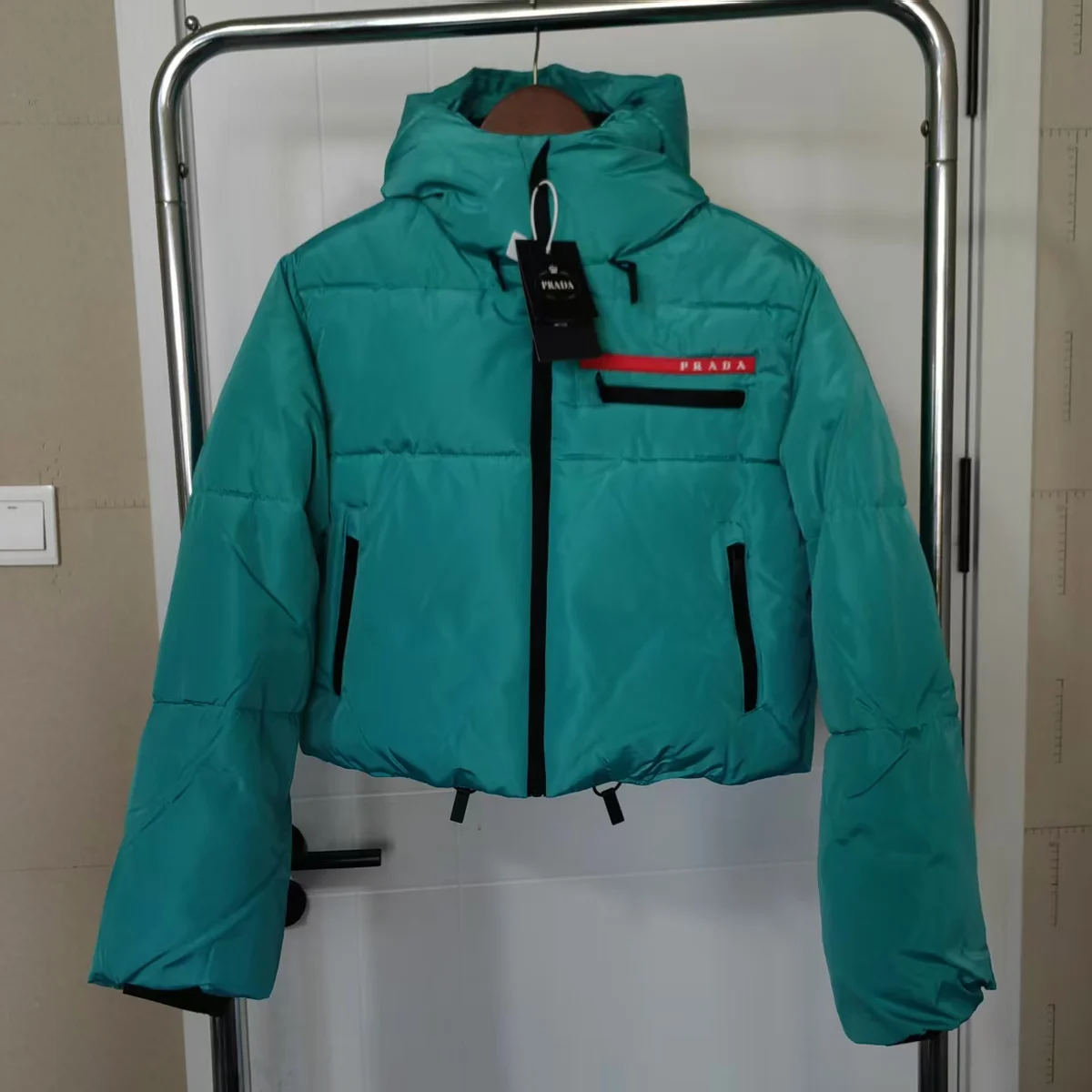 Prada Re-Nylon Teal Puffer Jacket — product photo on Sugargoo Spreadsheet