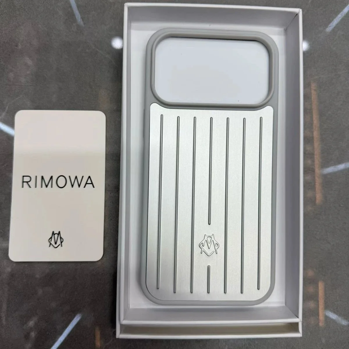Rimowa Silver Travel Case Phone Accessory — product photo on Sugargoo Spreadsheet